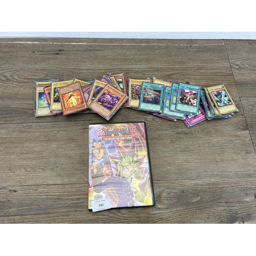 392 - A collection of 1996 and later Yu-Gi-Oh trading cards to include Salamandra, Gaia The Fierce Knight,... 