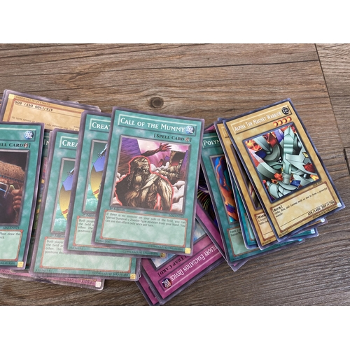 392 - A collection of 1996 and later Yu-Gi-Oh trading cards to include Salamandra, Gaia The Fierce Knight,... 