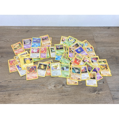 393 - A collection of 1990s Pokémon cards to include Blaine's Charizard, Blaine's Mankey, Brock's Zubat et... 