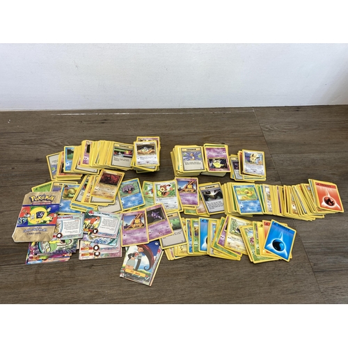 394 - A collection of 1990's and later Pokémon cards to include Eevee, Sentret, Gust of Wind etc.