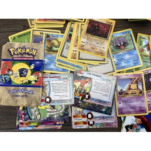 394 - A collection of 1990's and later Pokémon cards to include Eevee, Sentret, Gust of Wind etc.