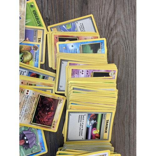 394 - A collection of 1990's and later Pokémon cards to include Eevee, Sentret, Gust of Wind etc.