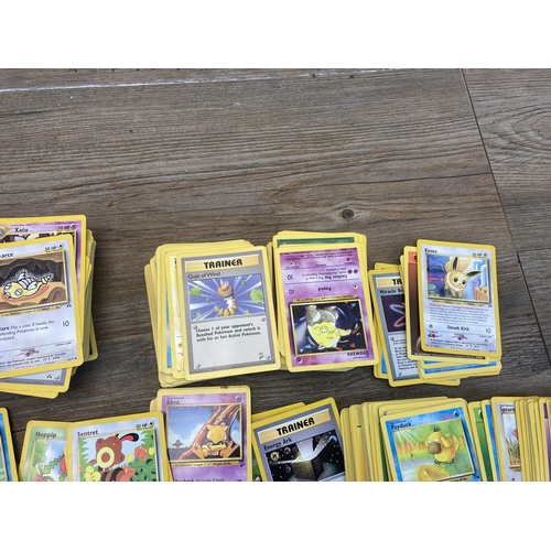 394 - A collection of 1990's and later Pokémon cards to include Eevee, Sentret, Gust of Wind etc.