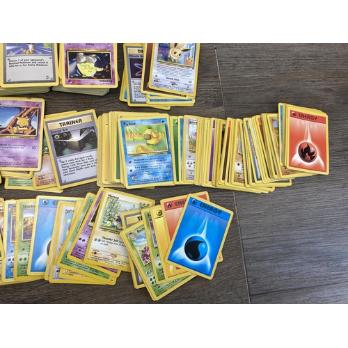 394 - A collection of 1990's and later Pokémon cards to include Eevee, Sentret, Gust of Wind etc.