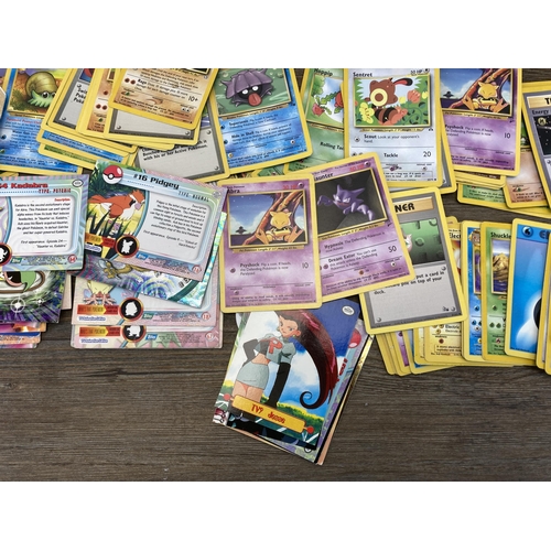 394 - A collection of 1990's and later Pokémon cards to include Eevee, Sentret, Gust of Wind etc.