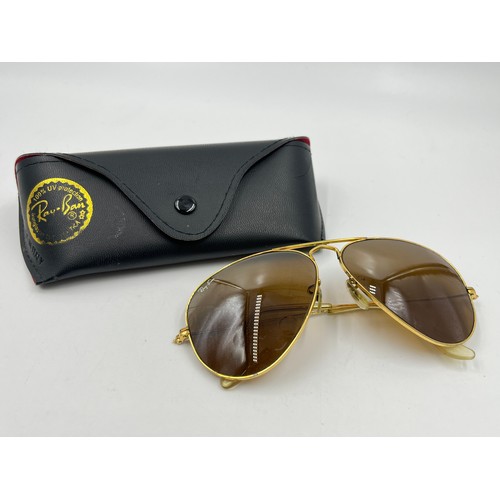 2358 - A cased pair of Ray-Ban gold tone Aviator sunglasses