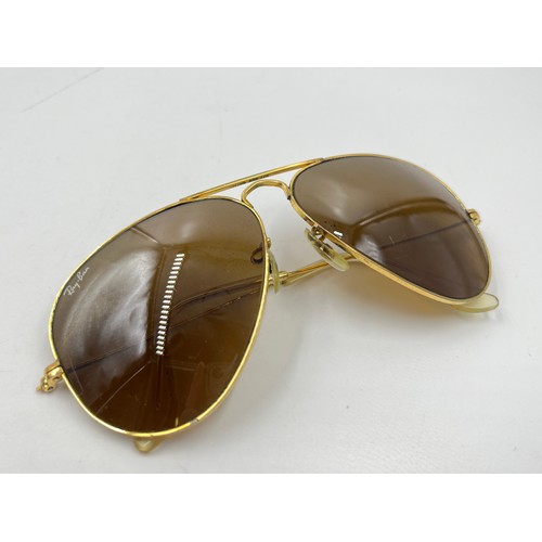 2358 - A cased pair of Ray-Ban gold tone Aviator sunglasses