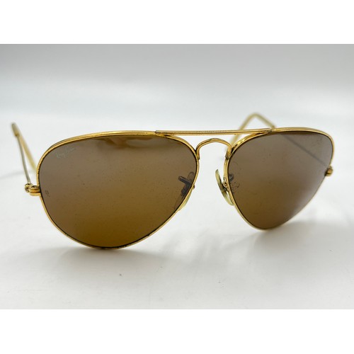 2358 - A cased pair of Ray-Ban gold tone Aviator sunglasses