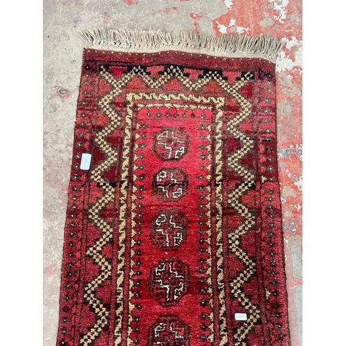 127 - A mid 20th century Afghan hall runner - approx. 137cm x 50cm