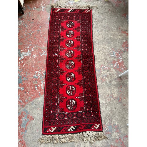 127A - A mid 20th century Afghan hall runner - approx. 137cm x 50cm