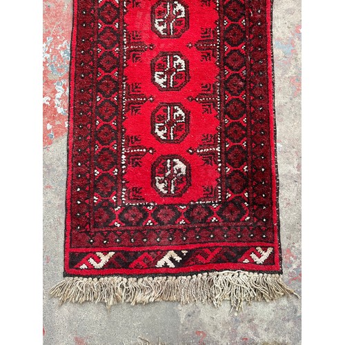 127A - A mid 20th century Afghan hall runner - approx. 137cm x 50cm