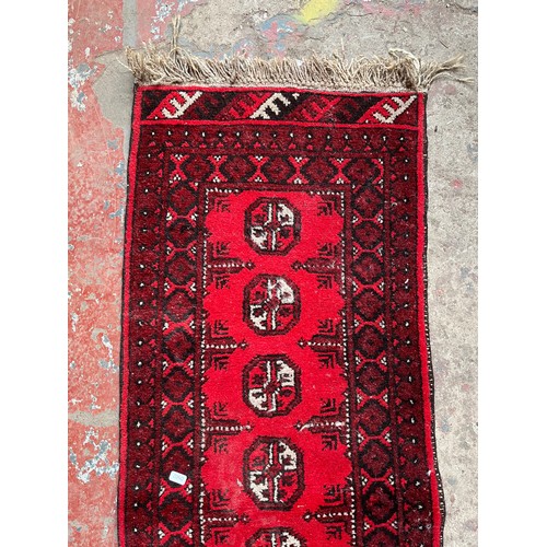 127A - A mid 20th century Afghan hall runner - approx. 137cm x 50cm