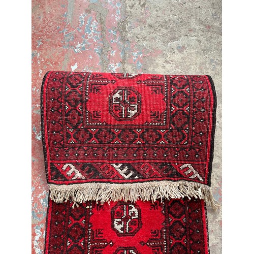 127A - A mid 20th century Afghan hall runner - approx. 137cm x 50cm