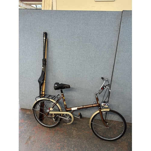 Two items one vintage Puch Promenade 20 bike together with a collection of pool and snooker cues to
