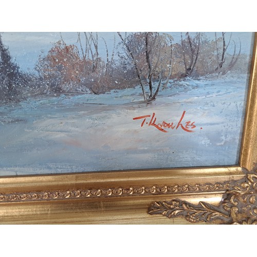 219 - A gilt framed oil on canvas of a winter landscape scene signed lower right - approx. 73cm high x 105... 