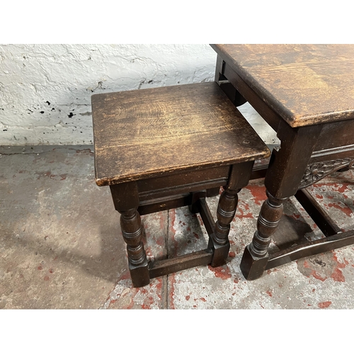 100 - A 17th century style carved oak nest of tables