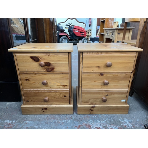 111 - A pair of pine bedside chests of drawers - approx. 59cm high x 47cm wide x 38cm deep