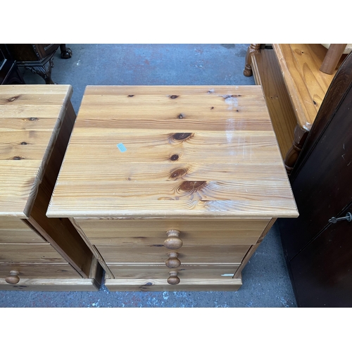 111 - A pair of pine bedside chests of drawers - approx. 59cm high x 47cm wide x 38cm deep