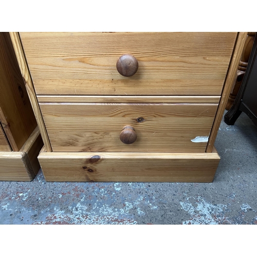 111 - A pair of pine bedside chests of drawers - approx. 59cm high x 47cm wide x 38cm deep