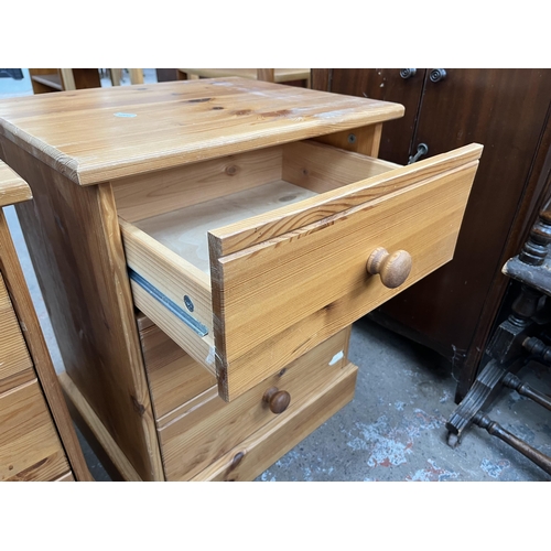 111 - A pair of pine bedside chests of drawers - approx. 59cm high x 47cm wide x 38cm deep