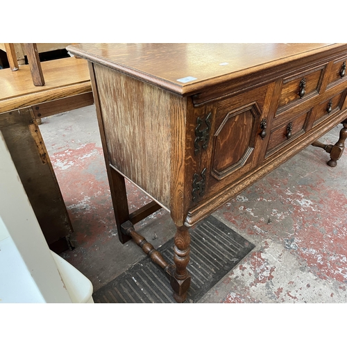 112 - An early 20th century carved oak sideboard - approx. 88cm high x 158cm wide x 48cm deep