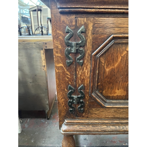 112 - An early 20th century carved oak sideboard - approx. 88cm high x 158cm wide x 48cm deep