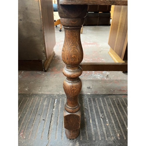 112 - An early 20th century carved oak sideboard - approx. 88cm high x 158cm wide x 48cm deep