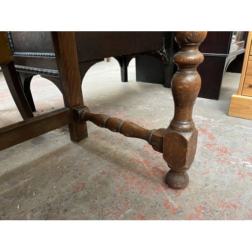 112 - An early 20th century carved oak sideboard - approx. 88cm high x 158cm wide x 48cm deep