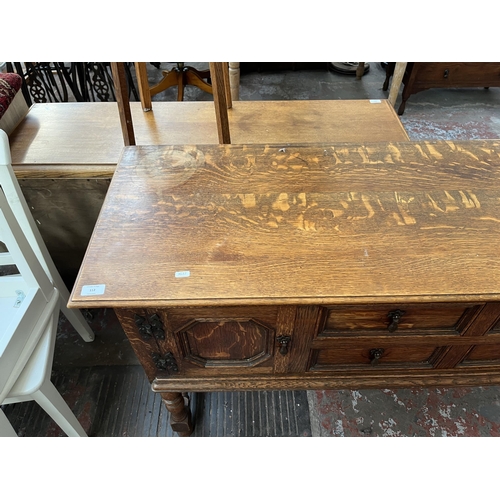 112 - An early 20th century carved oak sideboard - approx. 88cm high x 158cm wide x 48cm deep