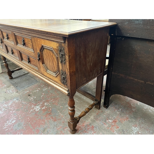 112 - An early 20th century carved oak sideboard - approx. 88cm high x 158cm wide x 48cm deep