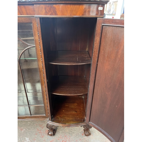 115 - An Edwardian mahogany display cabinet on ball and claw supports with two glazed doors and two outer ... 