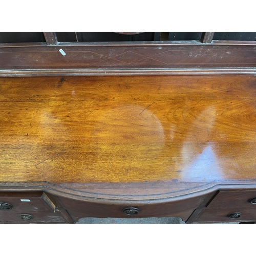 119 - An Edwardian inlaid mahogany bow fronted dressing table - approx. 82cm high x 113cm wide x 53cm deep