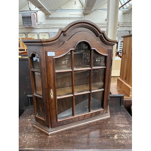 121 - An oak wall mountable display cabinet with single glazed door - approx. 70cm high x 65cm wide x 17cm... 