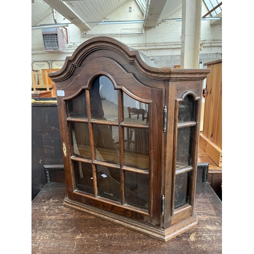 121 - An oak wall mountable display cabinet with single glazed door - approx. 70cm high x 65cm wide x 17cm... 