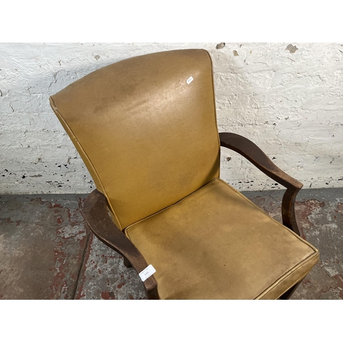 123 - A mid 20th century Parker Knoll PK731 beech and yellow vinyl armchair
