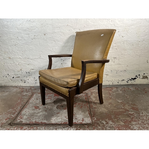 123 - A mid 20th century Parker Knoll PK731 beech and yellow vinyl armchair