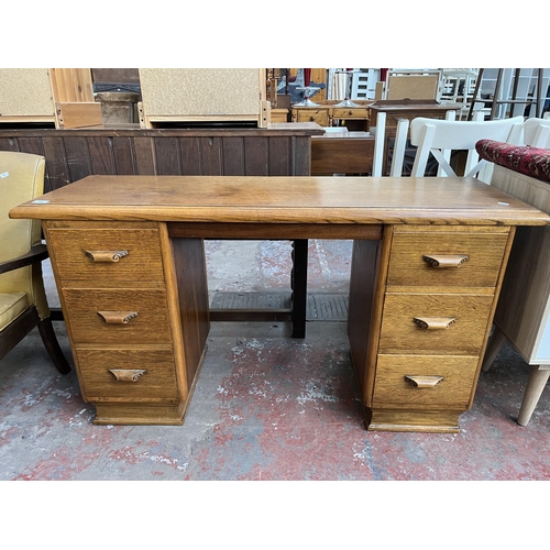 125 - A mid 20th century carved oak desk - approx. 74cm high x 137cm wide x 46cm deep