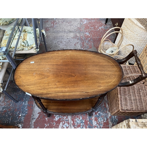 130 - A 19th century style inlaid mahogany pie crust edge oval two tier tea trolley on brass castors - app... 