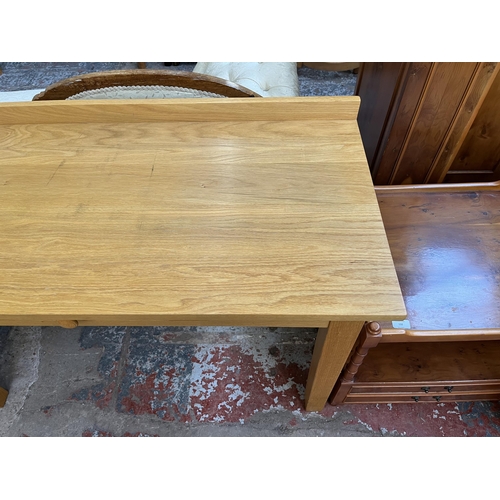 131 - A modern oak writing desk - approx. 82cm high x 122cm wide x 56cm deep