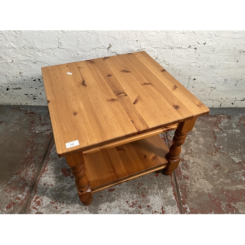 133 - A pine two tier side table - approx. 47cm high x 55cm wide x 55cm long