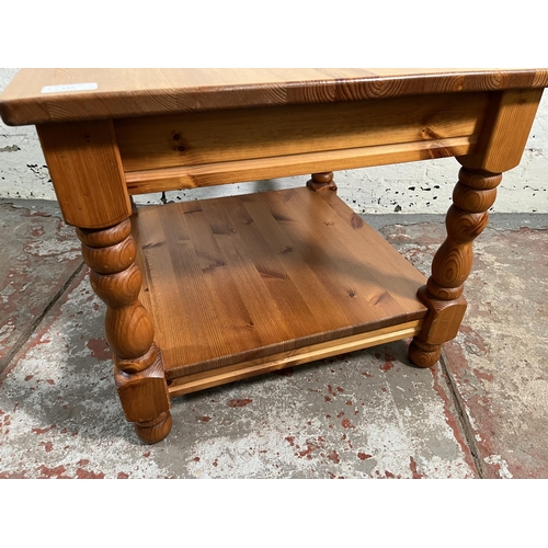 133 - A pine two tier side table - approx. 47cm high x 55cm wide x 55cm long