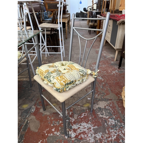 140 - A modern bevelled glass top and metal dining table and four chairs - approx. 76cm high x 75cm wide x... 