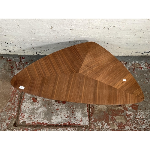 148 - A teak effect triangular coffee table - approx. 36cm high x 58cm wide x 105cm long