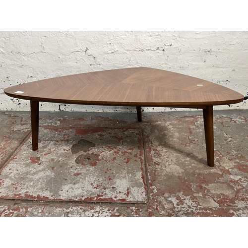 148 - A teak effect triangular coffee table - approx. 36cm high x 58cm wide x 105cm long