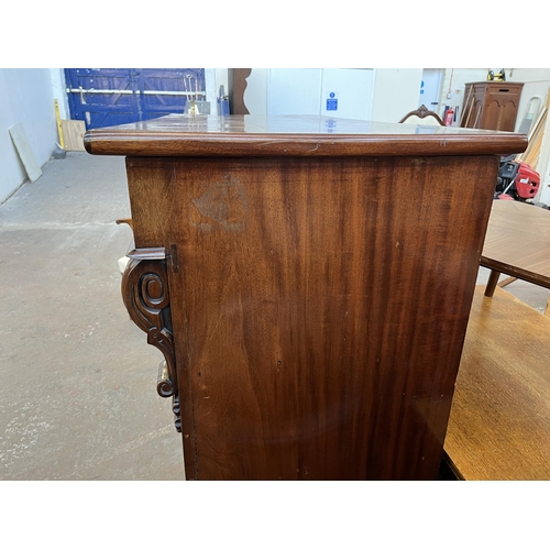 154 - A Victorian mahogany chest of drawers with carved acanthus leaf design - approx. 140cm high x 133cm ... 