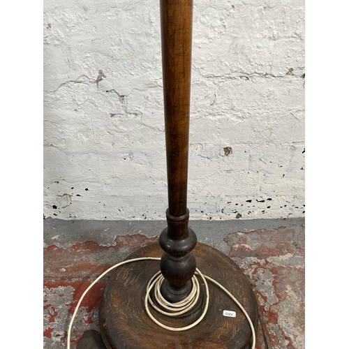 156 - A mid 20th century beech standard lamp with circular base - approx. 160cm high