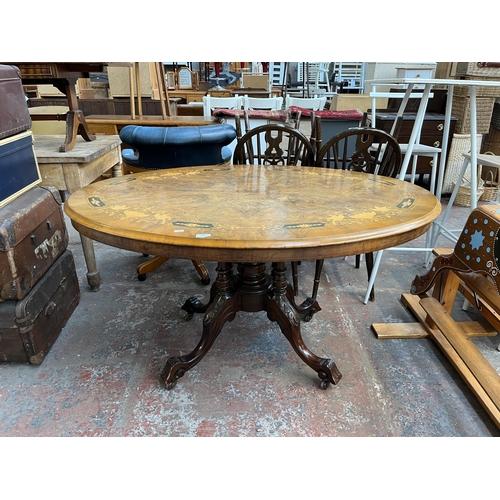 161 - A Victorian inlaid walnut oval tilt top loo table on quatrefoil base - approx. 73cm high x 94cm wide... 