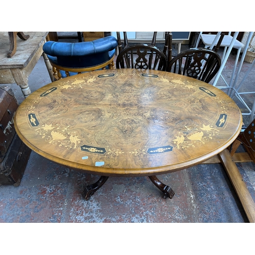 161 - A Victorian inlaid walnut oval tilt top loo table on quatrefoil base - approx. 73cm high x 94cm wide... 