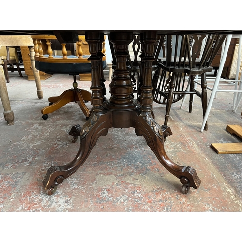 161 - A Victorian inlaid walnut oval tilt top loo table on quatrefoil base - approx. 73cm high x 94cm wide... 