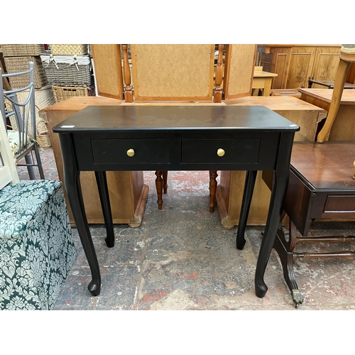 165 - A modern black painted two drawers console table - approx. 76cm high x 80cm wide x 40cm deep